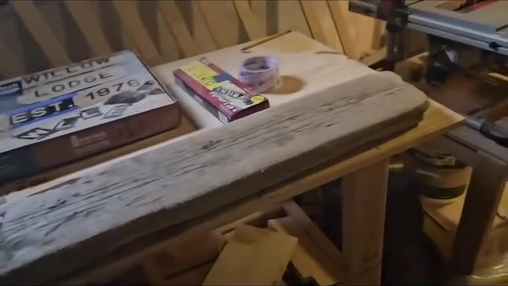The wood pieces laid out on the workbench
