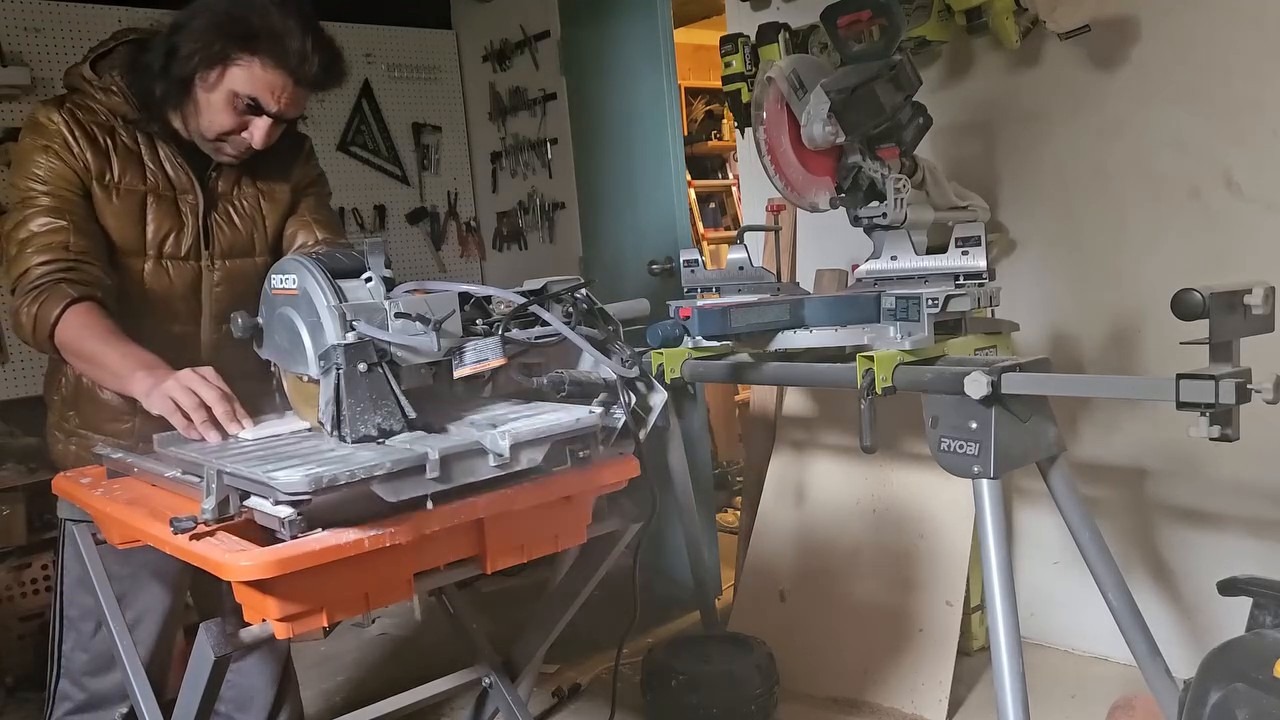 Cutting tiles on the RIDGID wet saw in the garage