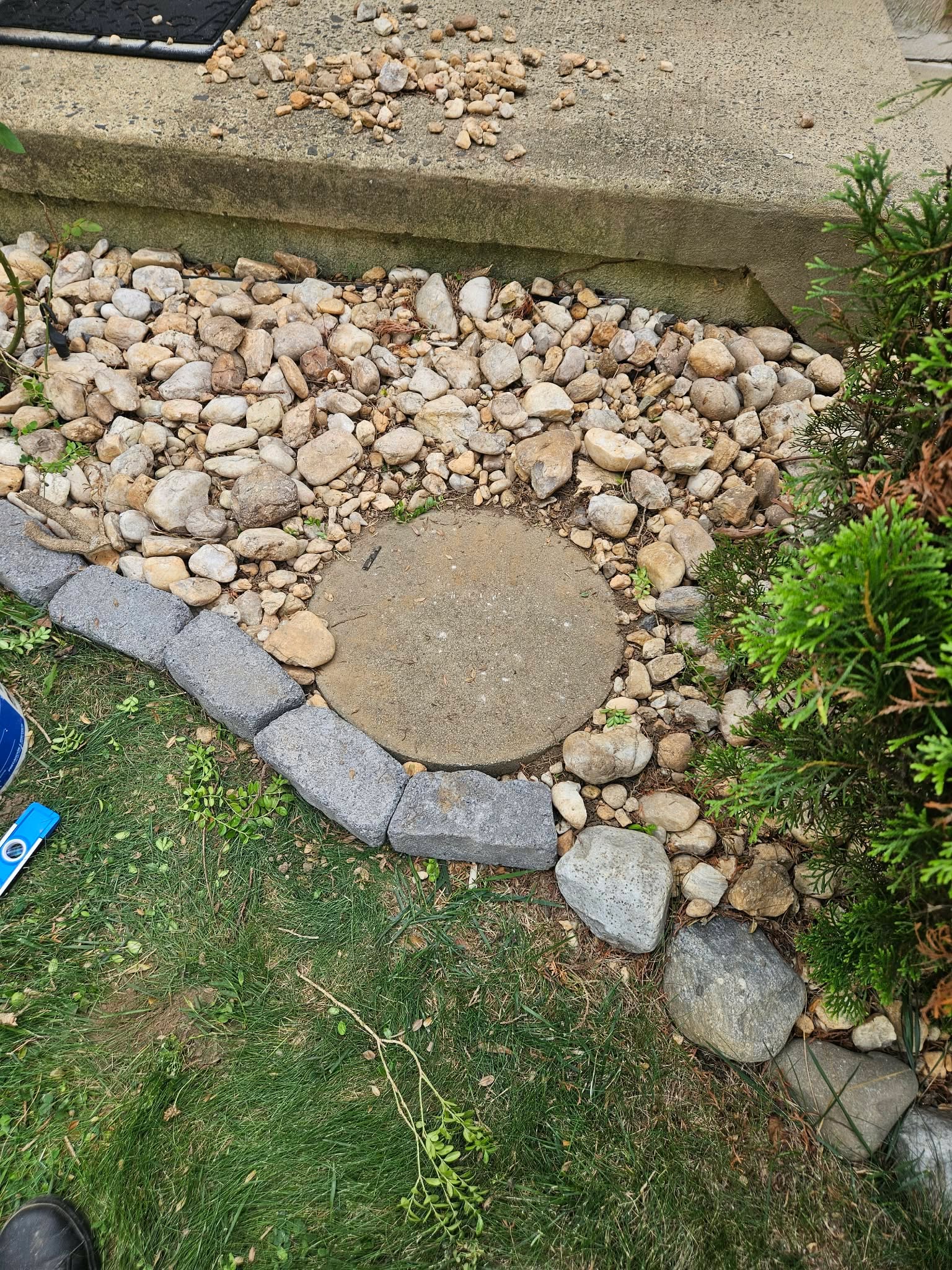 Checking the concrete base is level with a small torpedo level